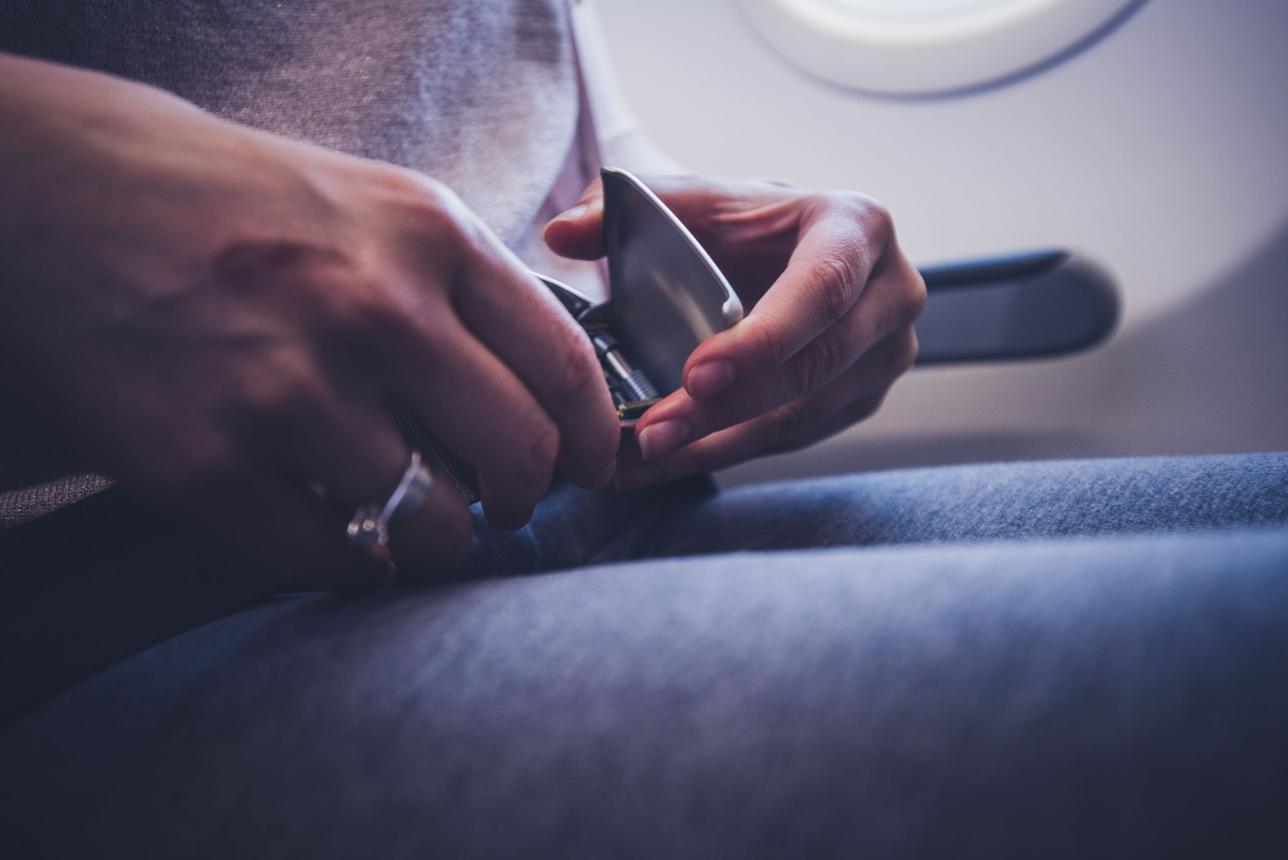 Keep your seat belt fastened on a plane